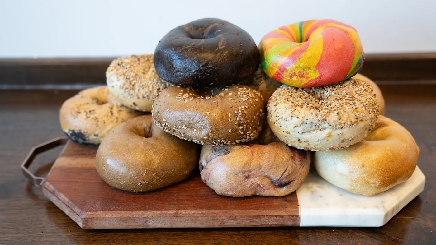 Assorted fresh bagels on a board